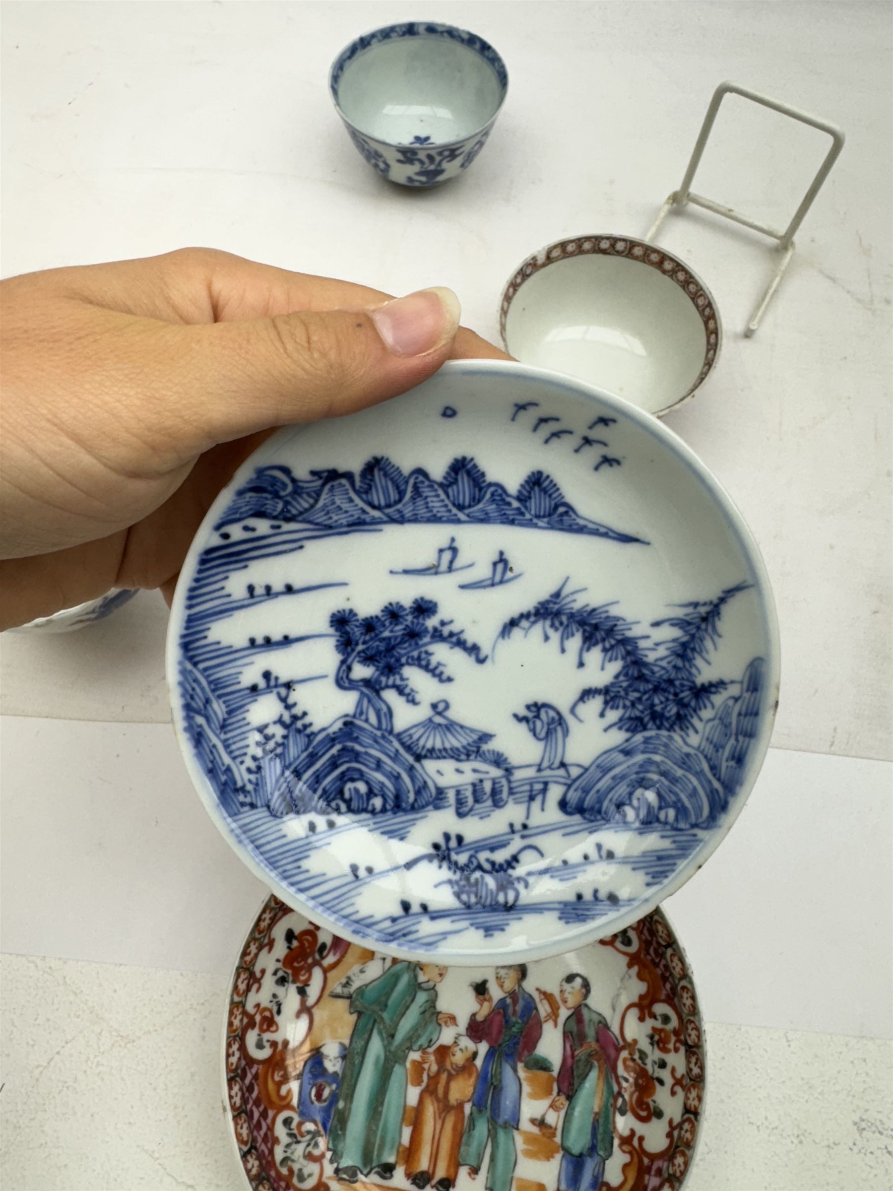 19th Century Chinese tea bowl and saucer, decorated with figures in a garden scene, together with tow other tea bowls and a saucer 