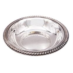 Mid 20th century silver dish, of circular form with oblique gadrooned rim, hallmarked Barker Ellis Silver Co, Birmingham 1965, D14.5cm, approximate weight 4.45 ozt (138.5 grams)