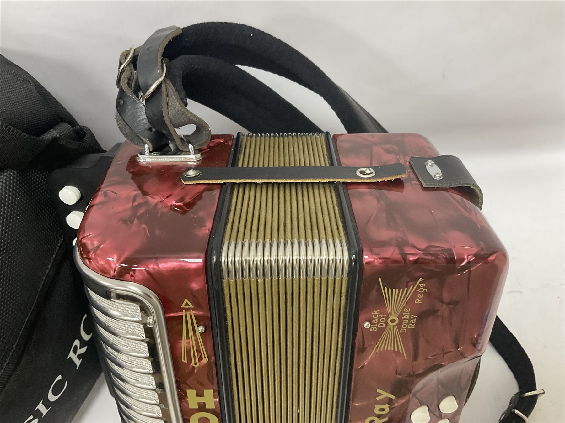 Hohner Double Ray black dot button melodeon in B/C; modern Irish style with eight bass and twenty-one treble buttons and double strap, with soft carrying case