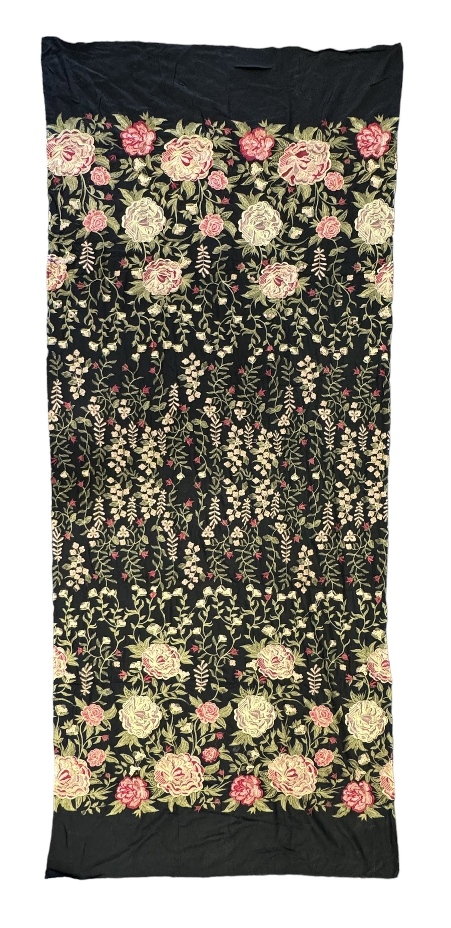 Embroidered Karandi fabric runner, the field featuring a black ground with an all-over floral design, including large pink and cream roses, accompanied by green leaves and small blossoms, bordered by plain sections at each end