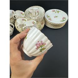 Coalport part tea service, decorated with floral sprigs, including eight cups and saucers, milk jug, eight dessert plates etc  