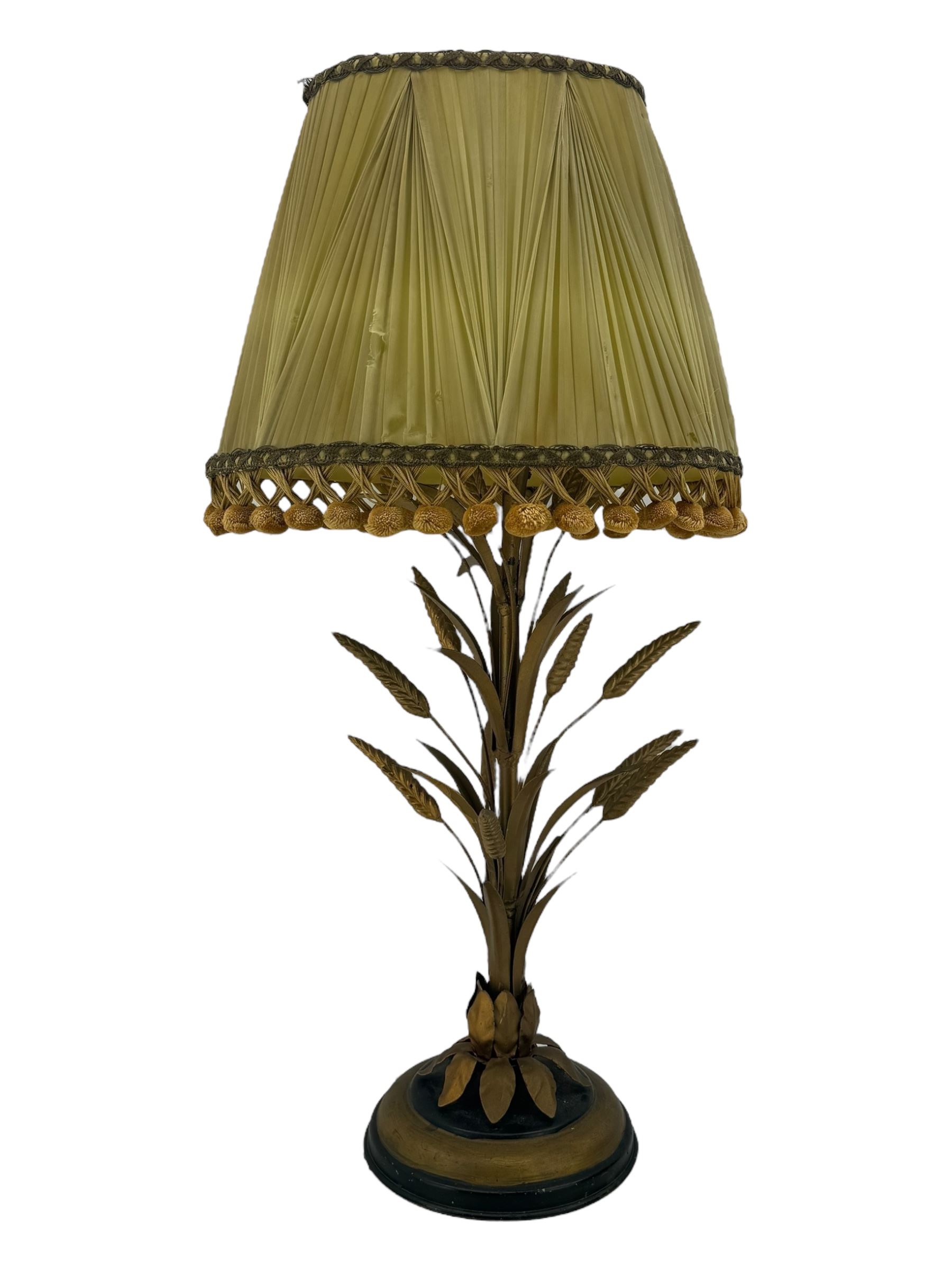 Italian mid century wheatsheaf design gilt and lacquer table lamp, on circular base with shade, H74cm overall, a three branch table lamp modelled as a candelabra, and one other table lamp (3)