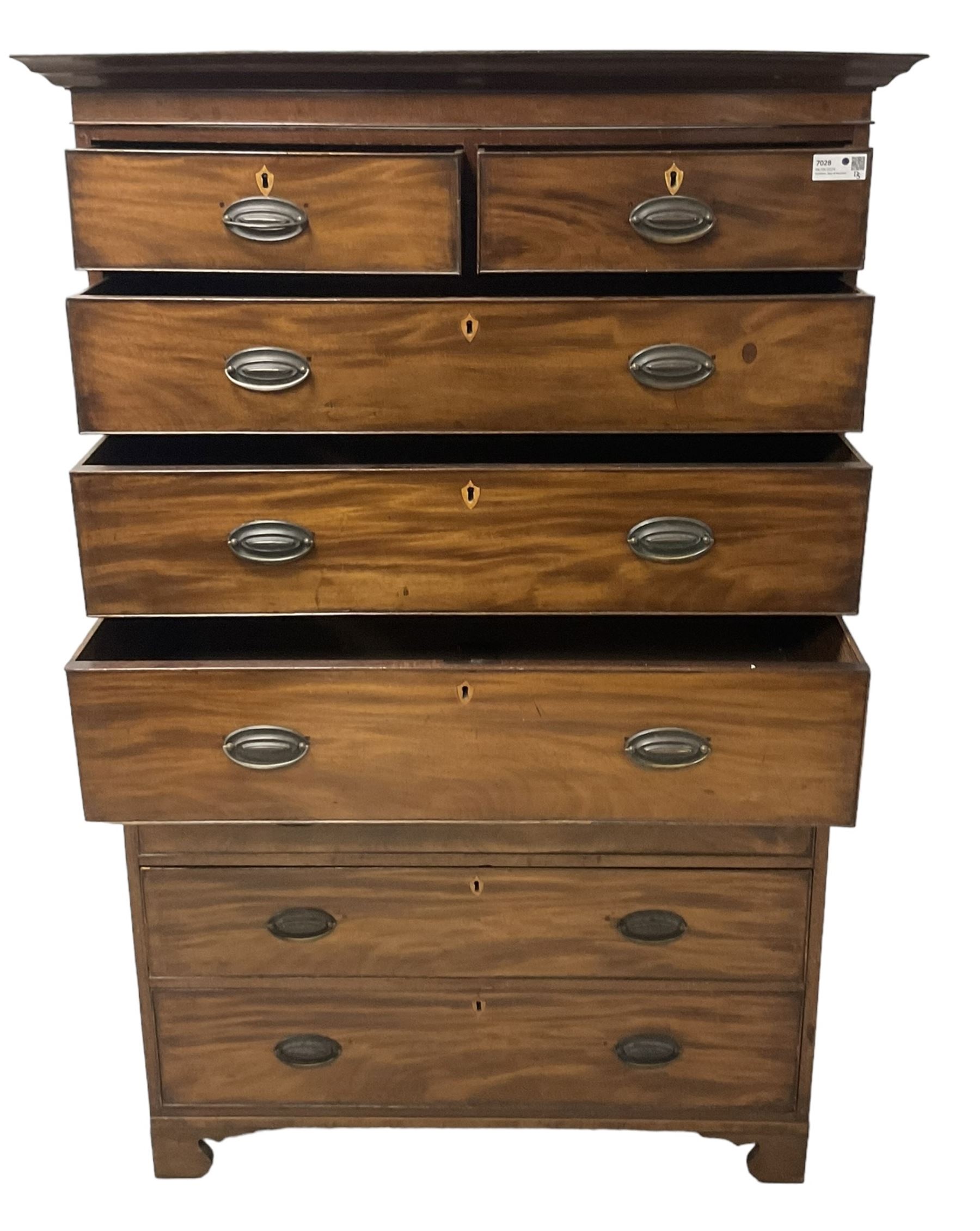 Early 19th century mahogany chest-on-chest, projecting cornice over banded frieze, fitted with two short over six long graduating cock-beaded drawers with bone and timber escutcheons, on bracket feet