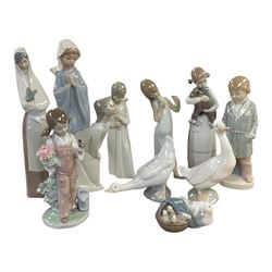 Four Lladro figures, including Girl holding bird no 5217, Duck and Ducklings no 4895 etc, ...