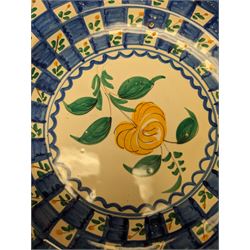 Six Spanish ceramic chargers, painted with bright floral patterns, three marked Lario, largest D35cm