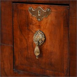 George II design walnut cabinet on stand, double arched top with applied mouldings over two astragal glazed doors, three internal shelves, the stand with moulded rectangular top fitted with three short drawers over shaped apron, on cabriole front supports 