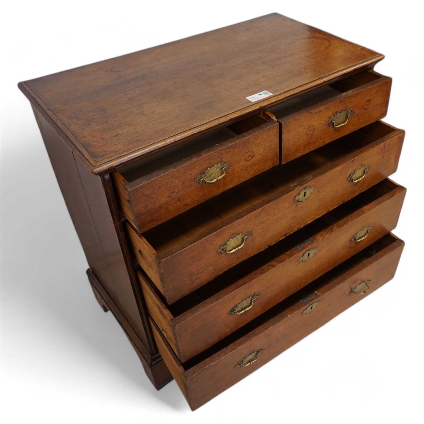 George III oak chest, moulded rectangular top over two short and three long drawers, shaped handles plates with engraved decoration, on bracket feet