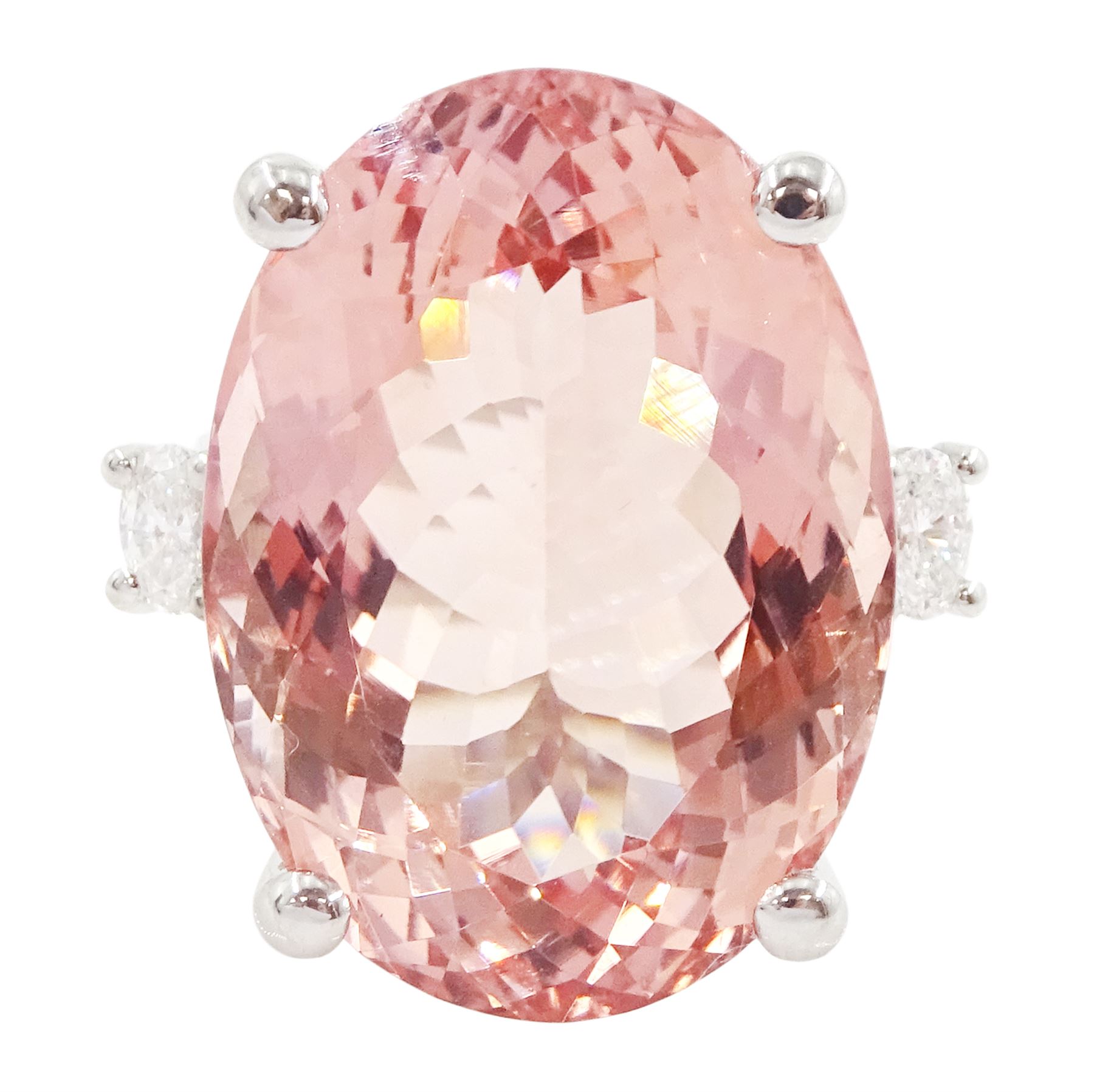 Platinum three stone large oval cut morganite and oval cut diamond ring, hallmarked, morganite 33.80 carat, total diamond weight 0.60 carat, with World Gemological Institute report