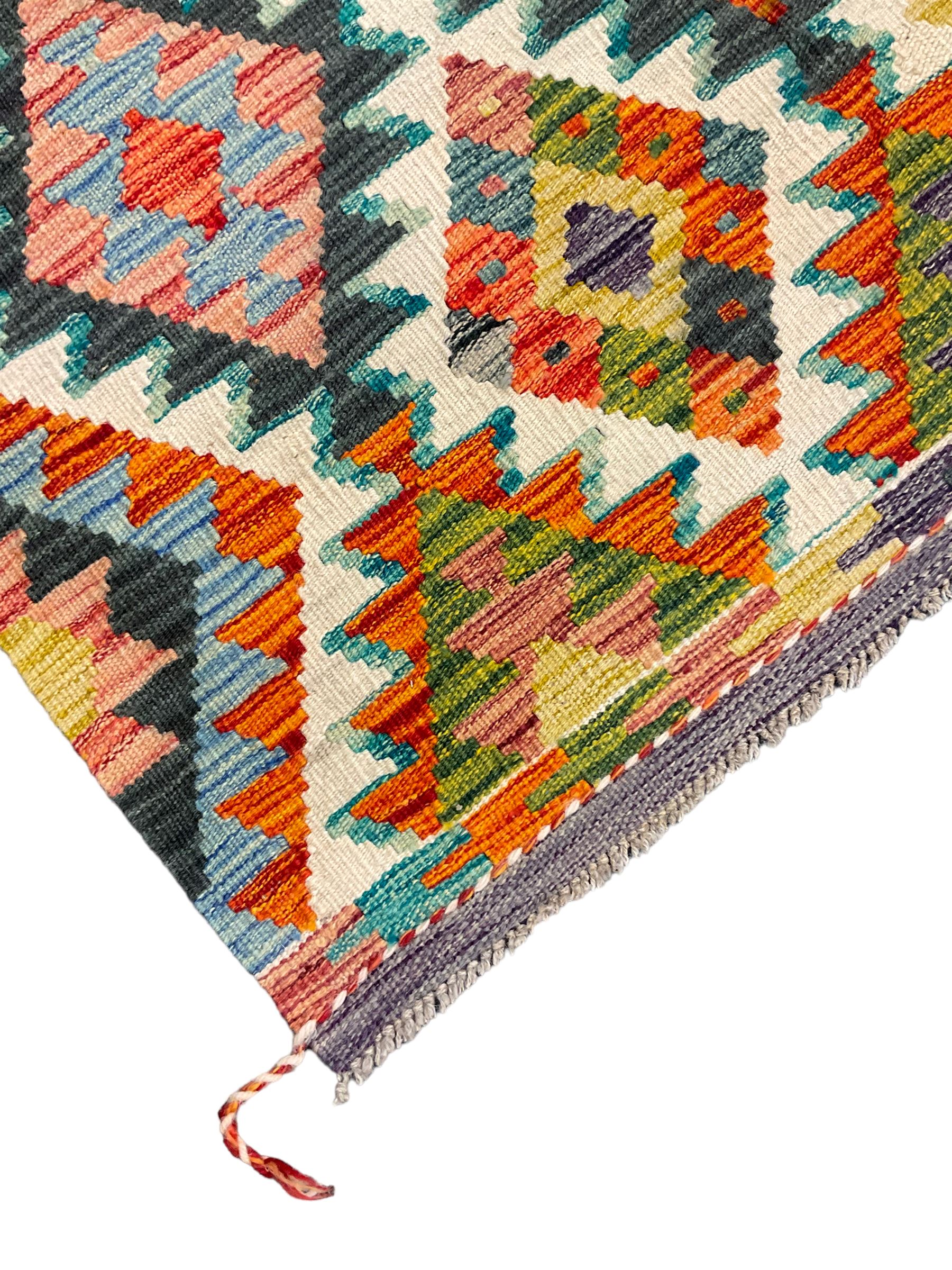 Chobi Kilim rug, over geometric design, decorated with multi-coloured stepped lozenges