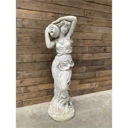 Composite garden figure of a woman holding urn 