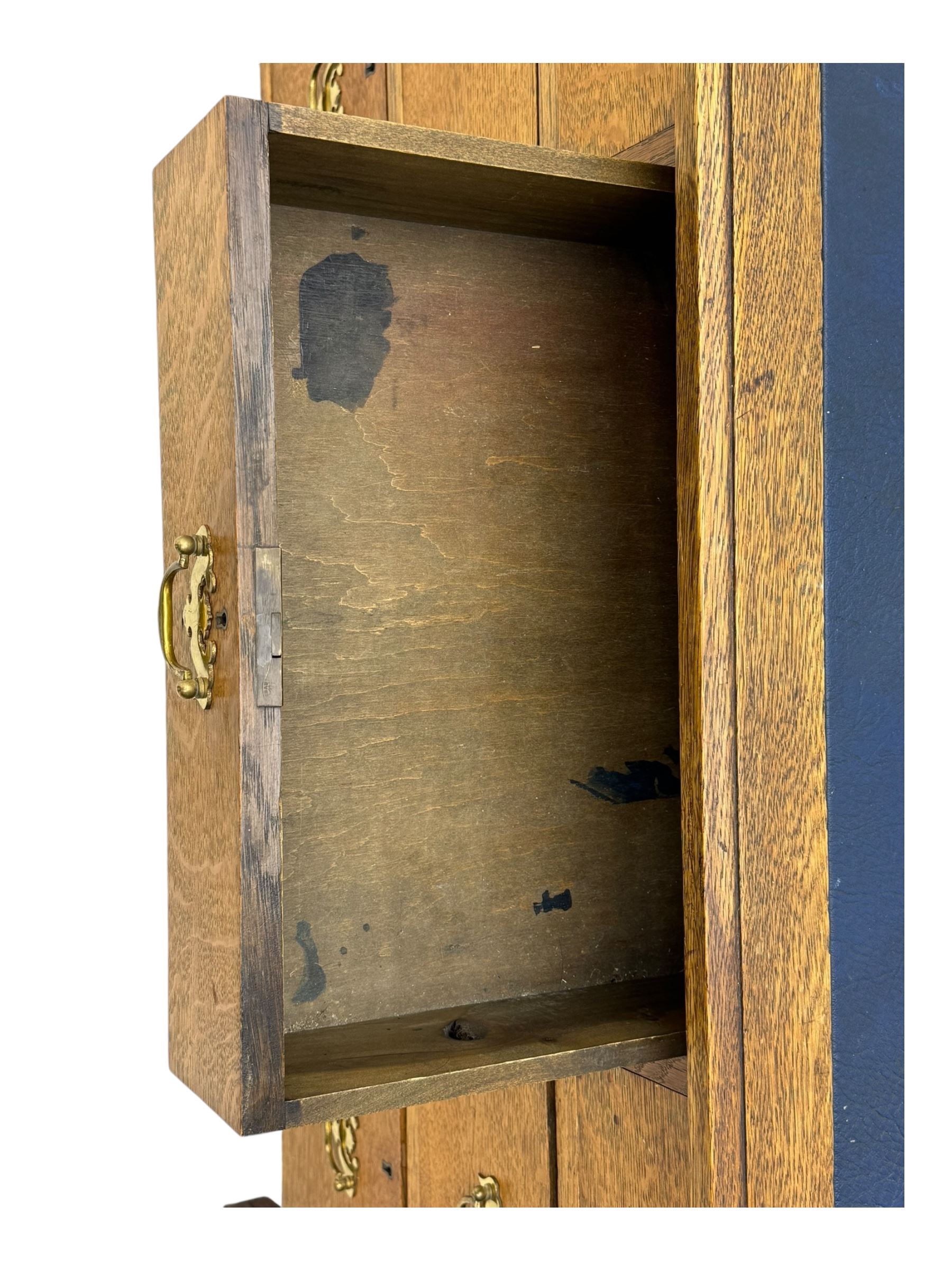 Edwardian oak twin pedestal desk, moulded rectangular top with inset writing surface, fitted with seven drawers, panelled sides, on stile supports 