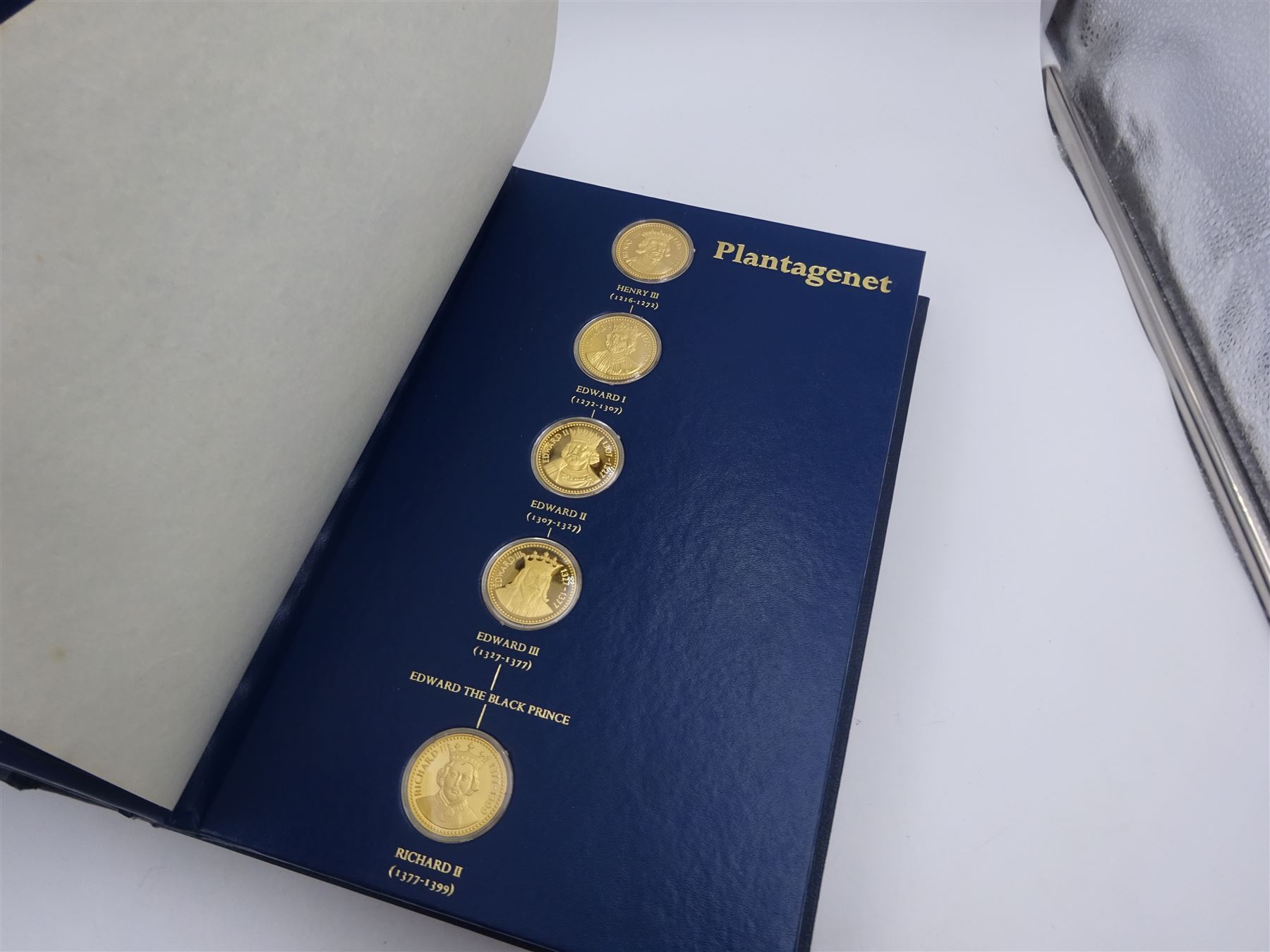 Franklin Mint, The Kings and Queens Collection, forty-three 24ct gold plated silver medallions, each engraved RSBS First Edition Silver Jubilee 1977 and hallmarked Franklin Mint, London 1978, contained within blue presentation folder