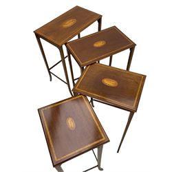 Edwardian inlaid mahogany quartetto nest of four occasional tables, each table with rectangular moulded top with satinwood band and central shell inlay, on square tapering supports with splayed terminals, inlaid with boxwood stringing