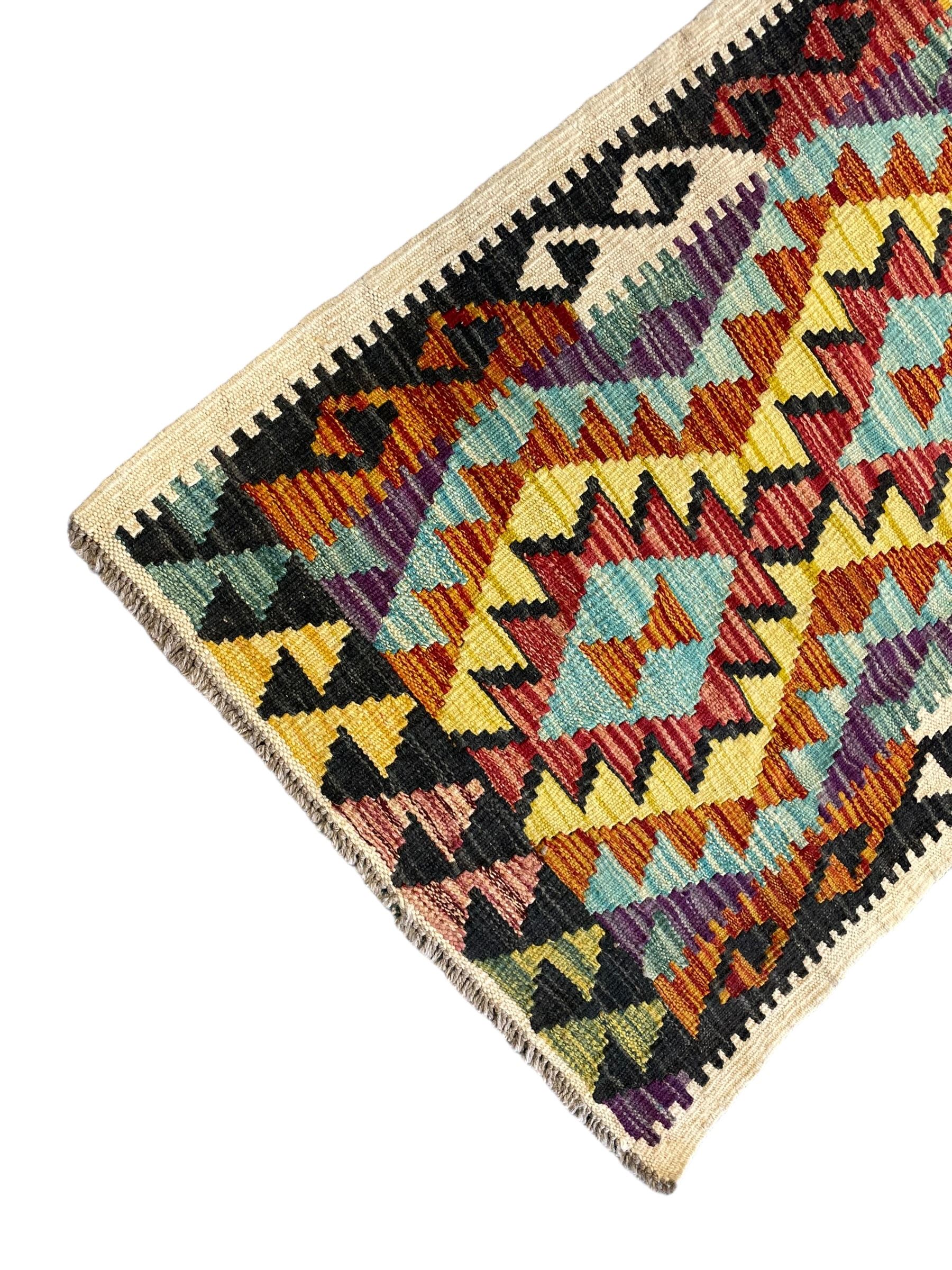 Chobi Kilim ivory ground runner rug, the field decorated with four multi-coloured lozenges, each with central geometric decoration, within concentric lozenges, enclosed by hooked border