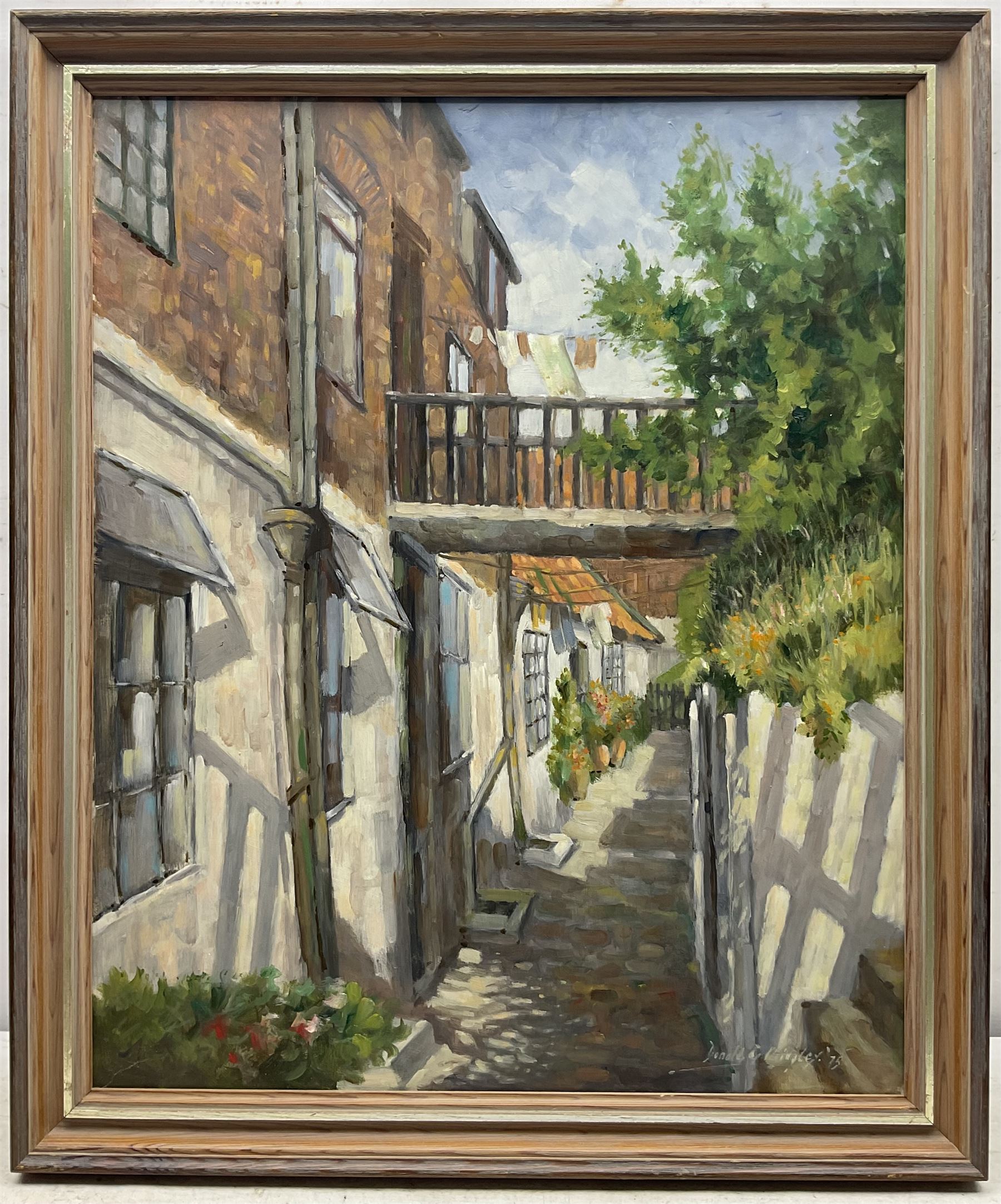 Donald Gray Midgely (British 1918-1995): Street in Robin Hood's Bay, oil on board signed and dated '75, 55cm x 45cm