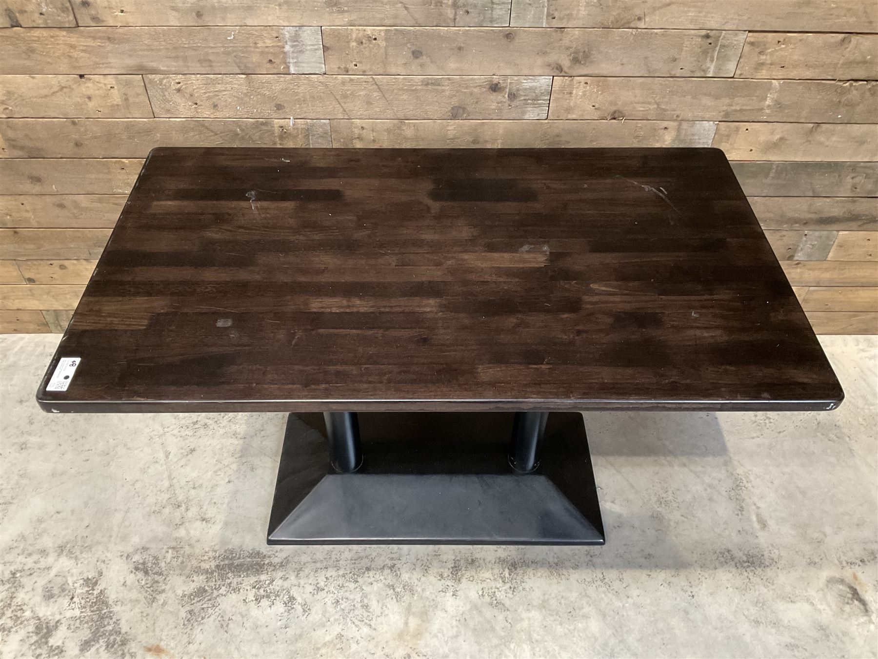 Two dark walnut rectangular console tables, on black metal bases