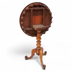 19th century rosewood and mahogany tripod table, circular tilt-top with rosewood band and shaped fretwork skirt, on turned column with three splayed supports with block feet 