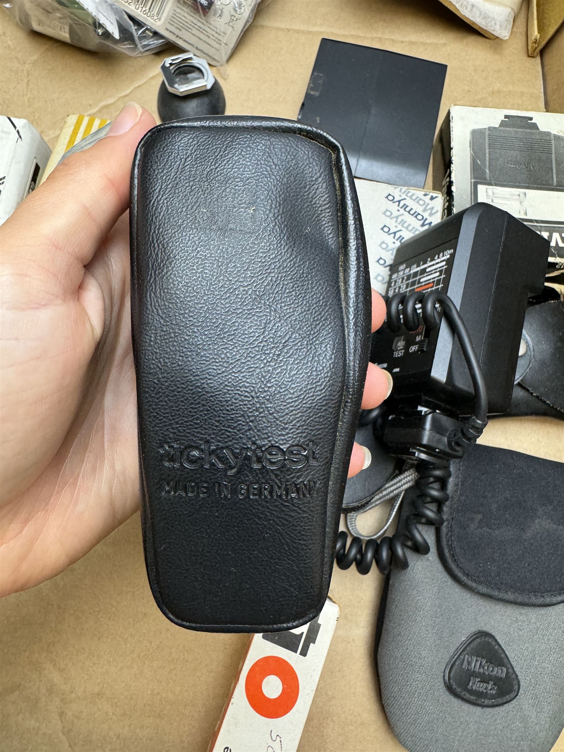 Collection of camera accessories, including Cobra 700AF flash, Weston Euro-Master exposure meter, cases, grips batteries, etc 