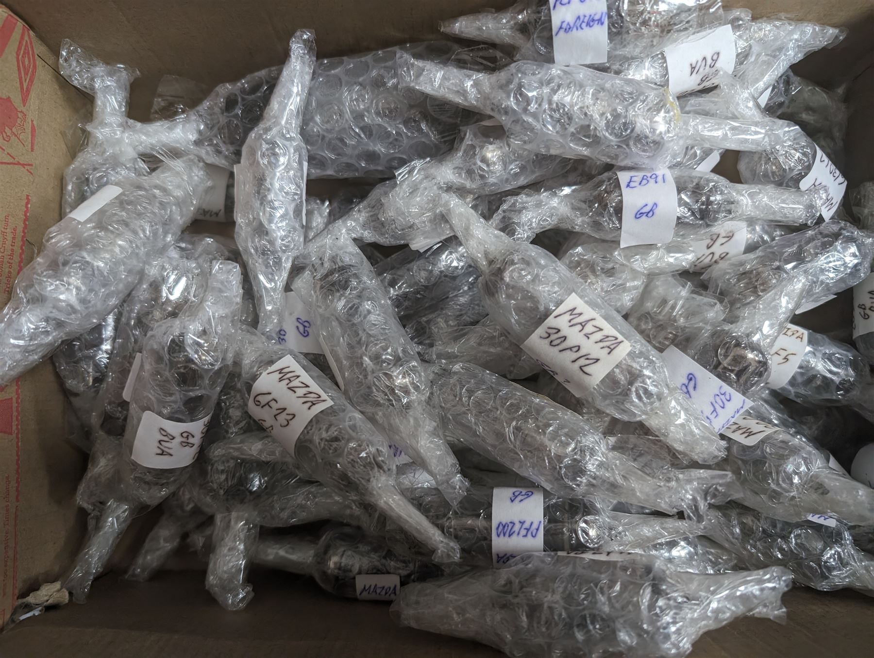 Large collection of Mazda thermionic radio valves/vacuum tubes, including boxed examples and loose bubble wrapped and identified examples