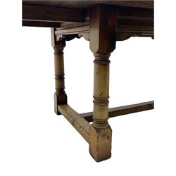 Oak refectory dining table, rectangular three plank top with cleated ends, two additional leaves, on turned supports united by H-stretchers 