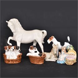 Two Royal Doulton figures of puppies in baskets, together with Beswick horse and other animal figures