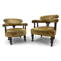 Victorian pair of mahogany armchairs, upholstered in gold velvet fabric, each with curved back, pierced splat and scroll arms, one with rounded seat and the other square, on turned front supports with castors