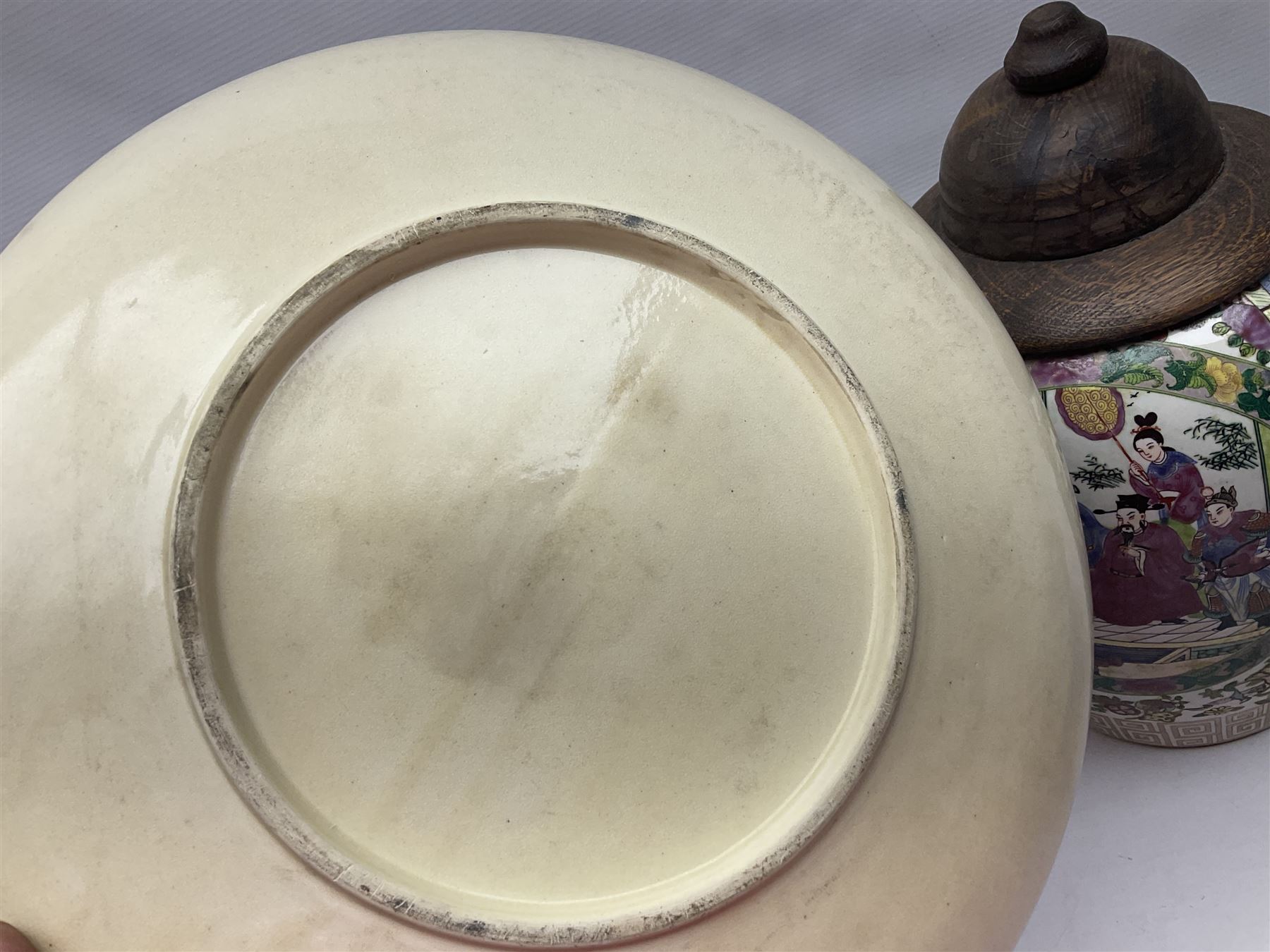 20th century Chinese famille rose jar, the body decorated in polychrome enamels with floral and foliate decoration on a white ground with a central figural panel and gilt key border to base, with six character mark beneath, H31cm, with later turned wooden cover, together with a similar footed bowl and jar,  jar cover with temple dog finial and a large Japanese Satsuma charger