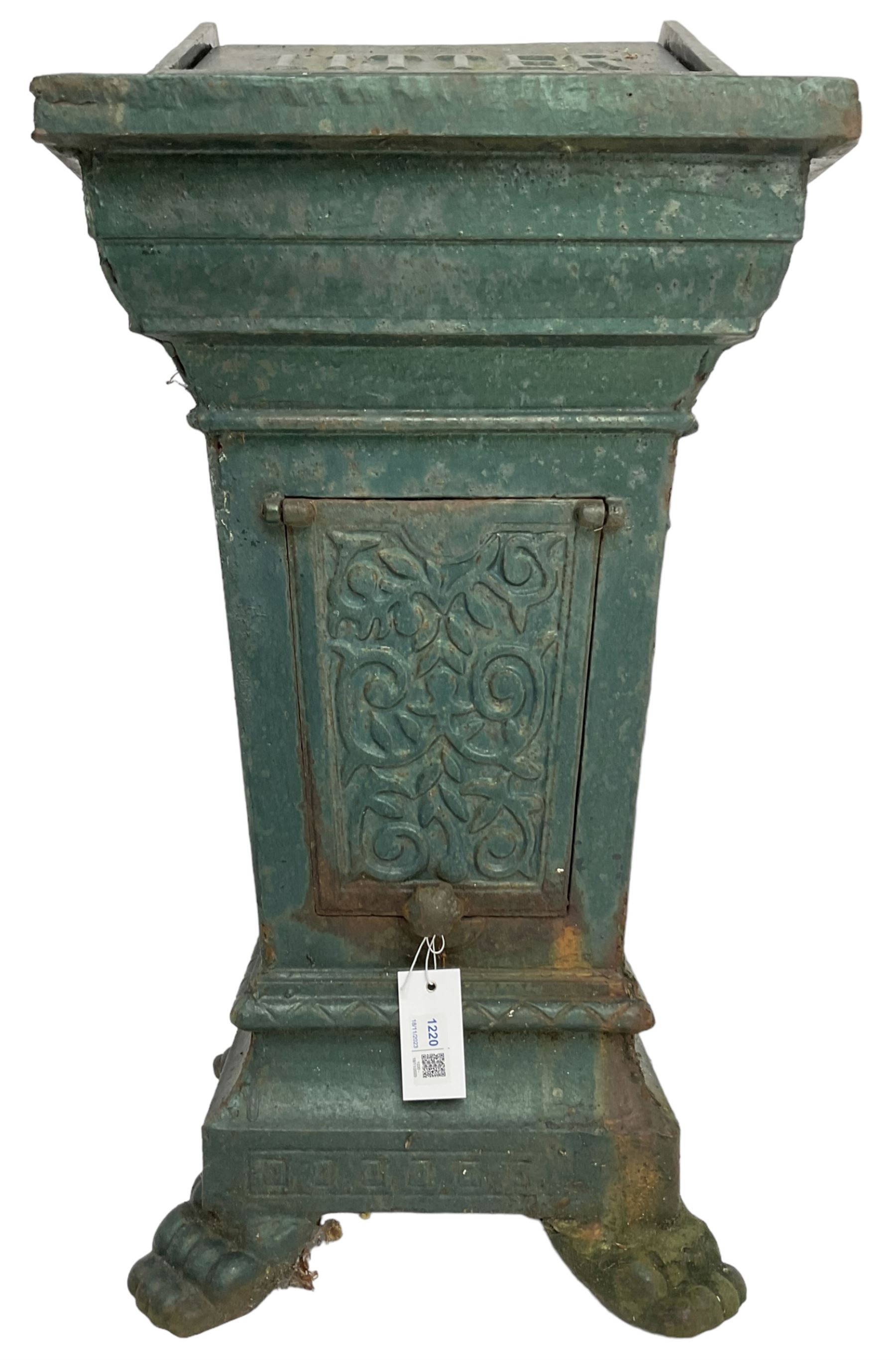 Early 20th century cast iron litter bin, square tapering form with scrolling foliate decoration, on paw feet