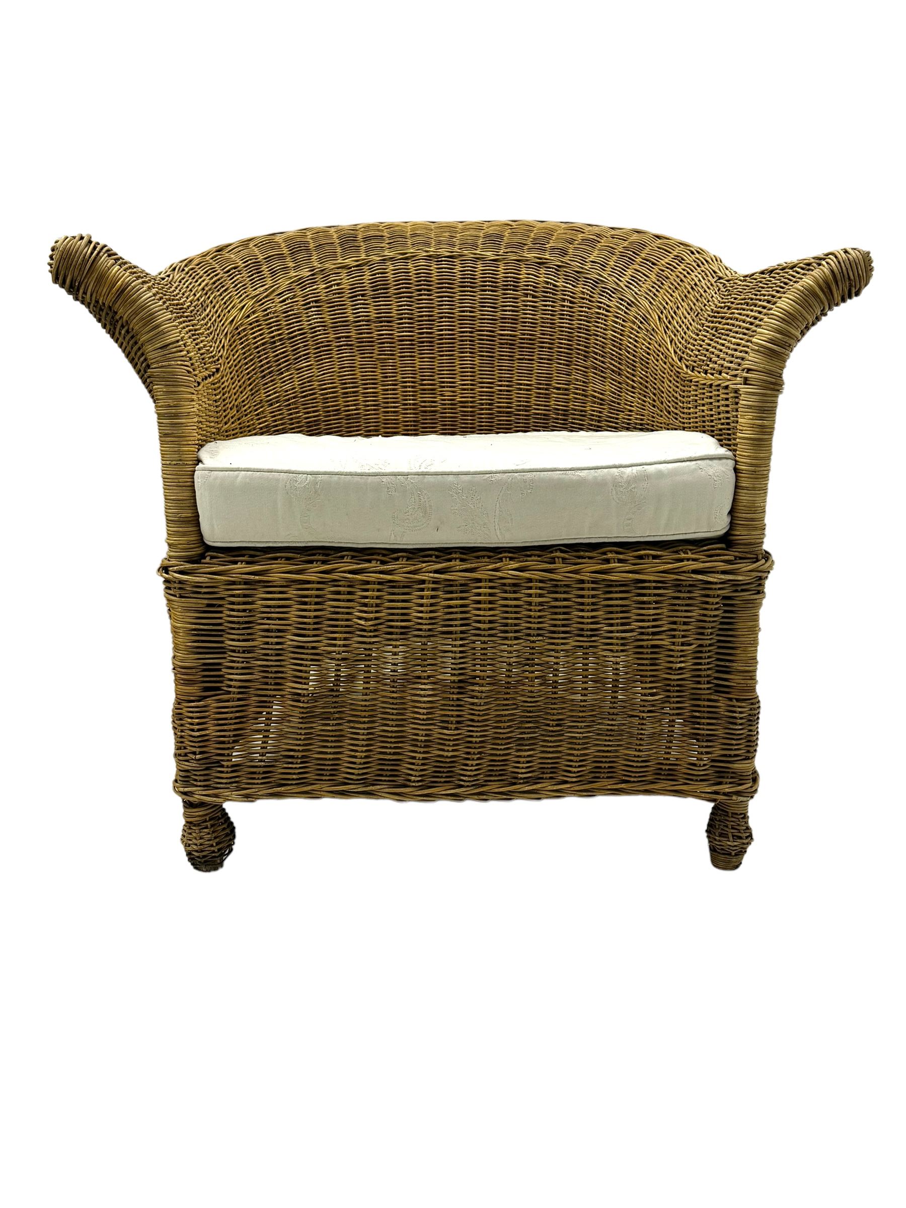 Rattan armchair and ottoman set, pair of armchairs featuring rounded backrests with wide armrests, woven wicker frame with weaving and upholstered seat cushions in off-white fabric with flowing floral pattern (W83 D80 H78cm); matching round ottoman with upholstered cushion on square wooden feet (W65 D65 H37cm)