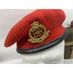 Five military caps/berets comprising two peaked caps with 'Yorkshire' and 'Royal Engineers' badges; maroon beret with parachute regiment badge; red beret with Military Police badge; and AB seaman hat with HM Submarines band; and a felt and webbing covered water bottle (6)