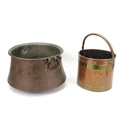 Large twin handled copper cauldron, together with a hammered and polished copper bucket wi...