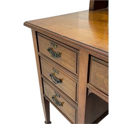 Late 19th century walnut dressing table, wide rectangular bevelled swing mirror in moulded frame, shaped horns carved with scrolls, moulded rectangular top over seven drawers, on square tapering supports with spade feet 