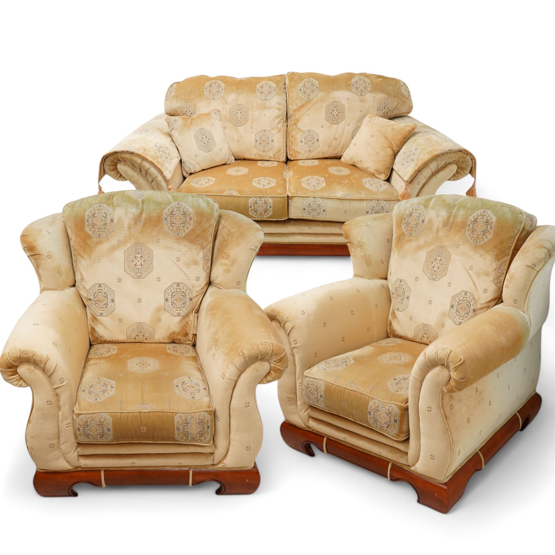 Three-seat sofa (W197cm, D103cm) and pair of matching armchairs (W100cm); upholstered in pale gold fabric decorated with Gul motifs, hardwood framed with polished base