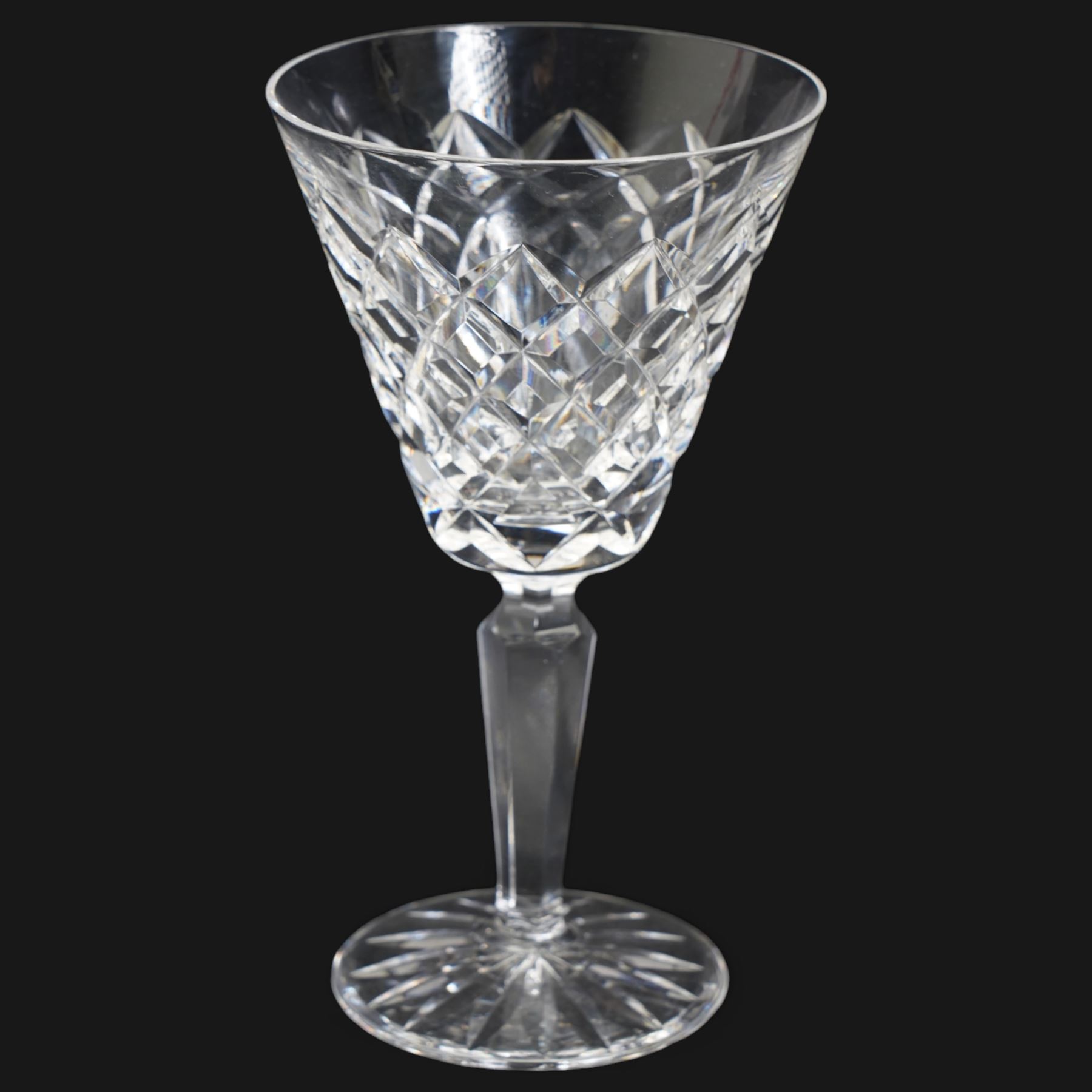 Suite of Waterford Tyrone pattern crystal to include six water goblets, H18cm, six red wine glasses, H17cm, seven white wine glasses, H16cm, six champagne flutes H18cm, six port glasses H14cm, nine champagne coupes, eight tumblers, six dessert bowls and serving/ fruit bowl