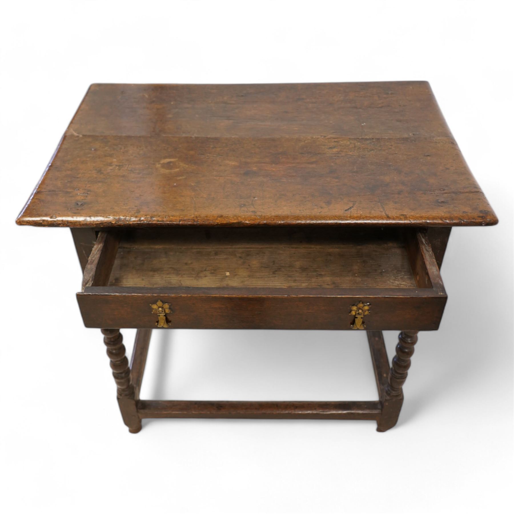 17th century oak side table, two plank rectangular top over single drawer, on bobbin-turned supports united by stretchers 