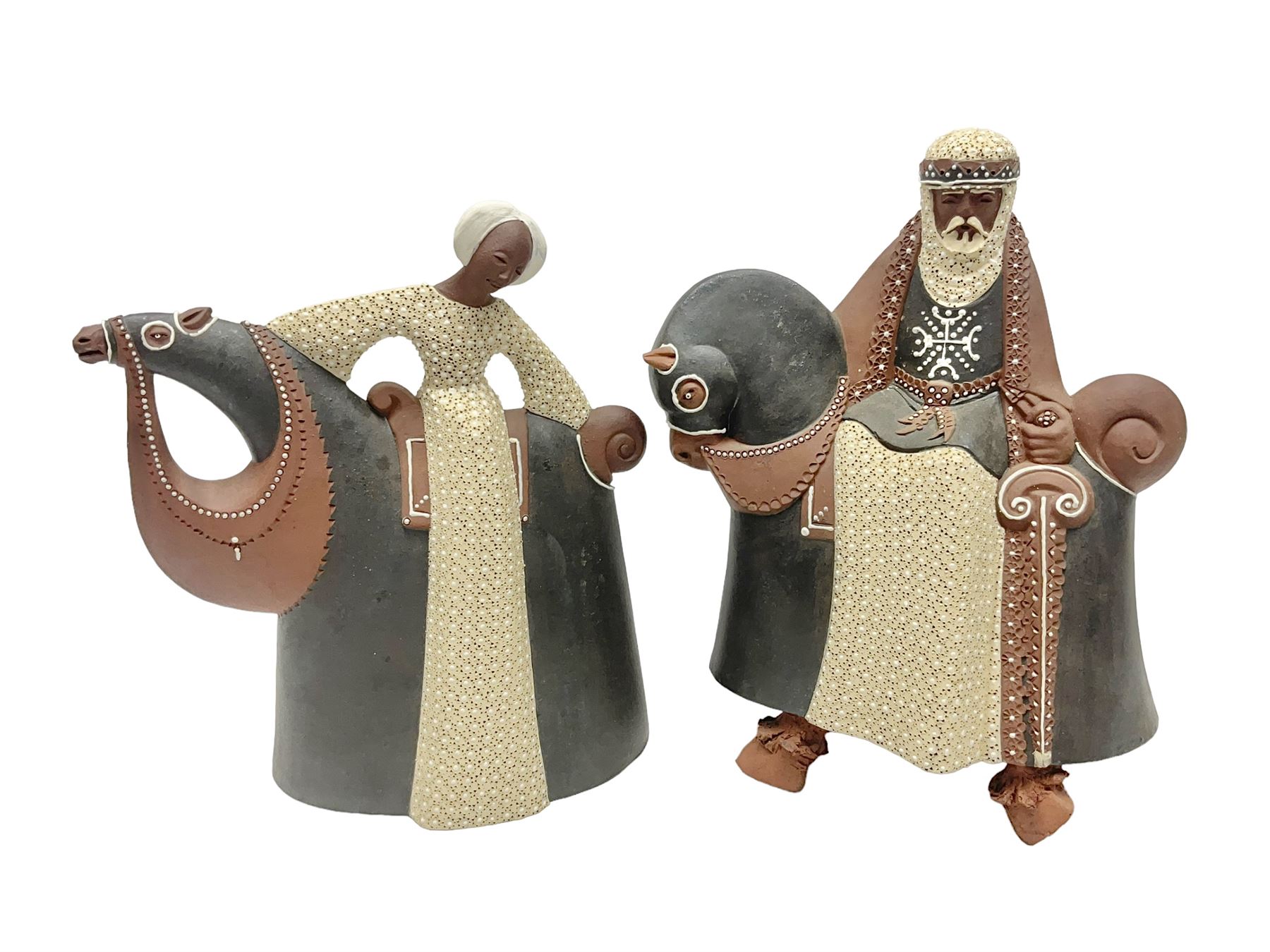 Leonard Stockley; two studio pottery figures modelled as a king and queen upon horses, both signed beneath,  H25cm