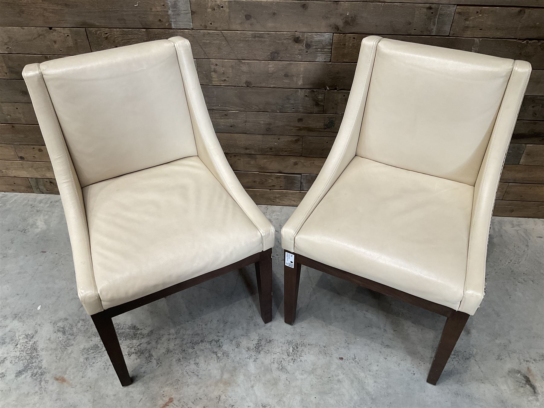 28 x walnut framed dining chairs, upholstered in beige leather