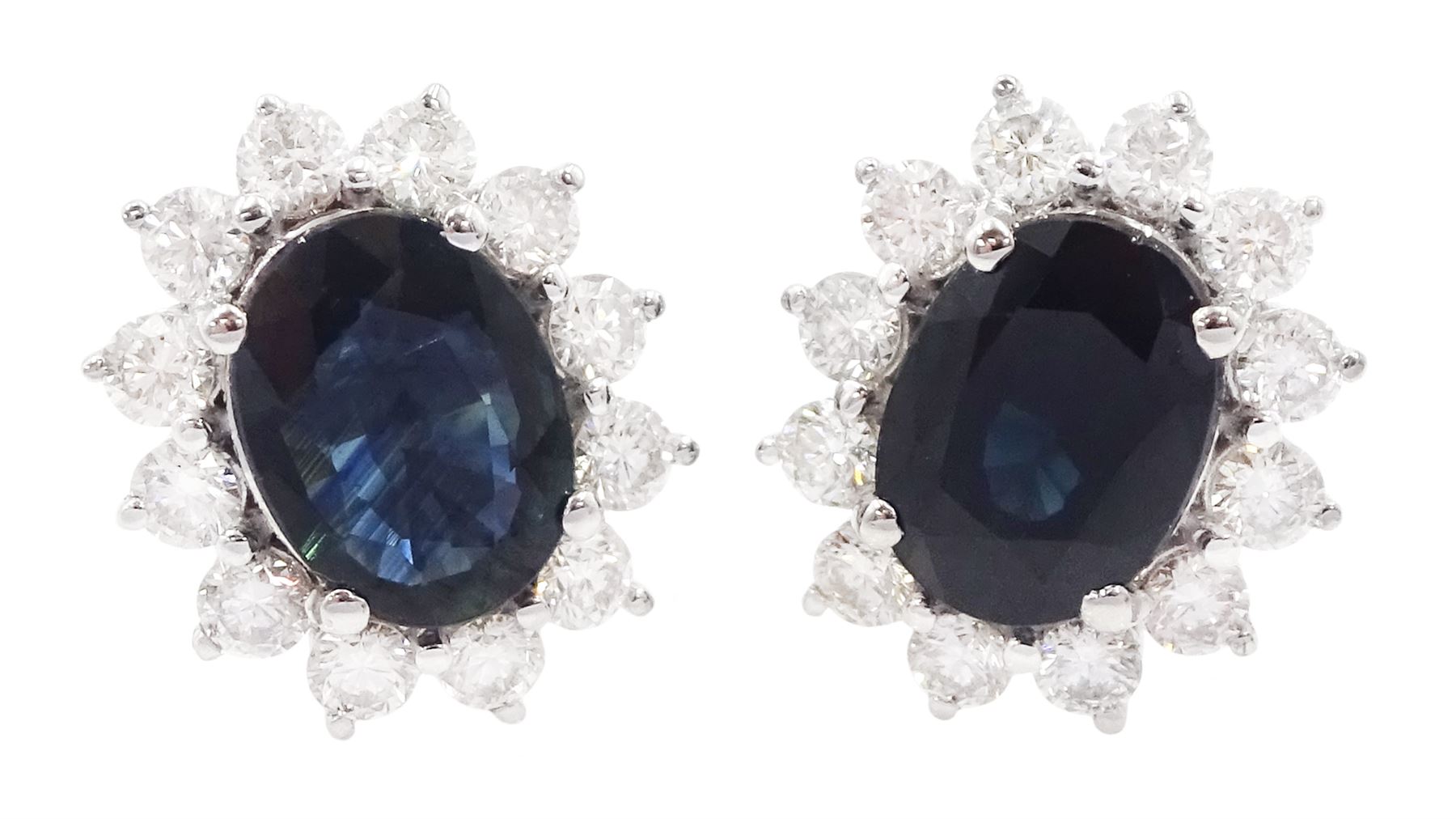 Pair of 18ct gold oval cut sapphire and round brilliant cut diamond cluster stud earrings, stamped 750, total sapphire weight approx 3.05 carat, total diamond weight approx 0.75 carat