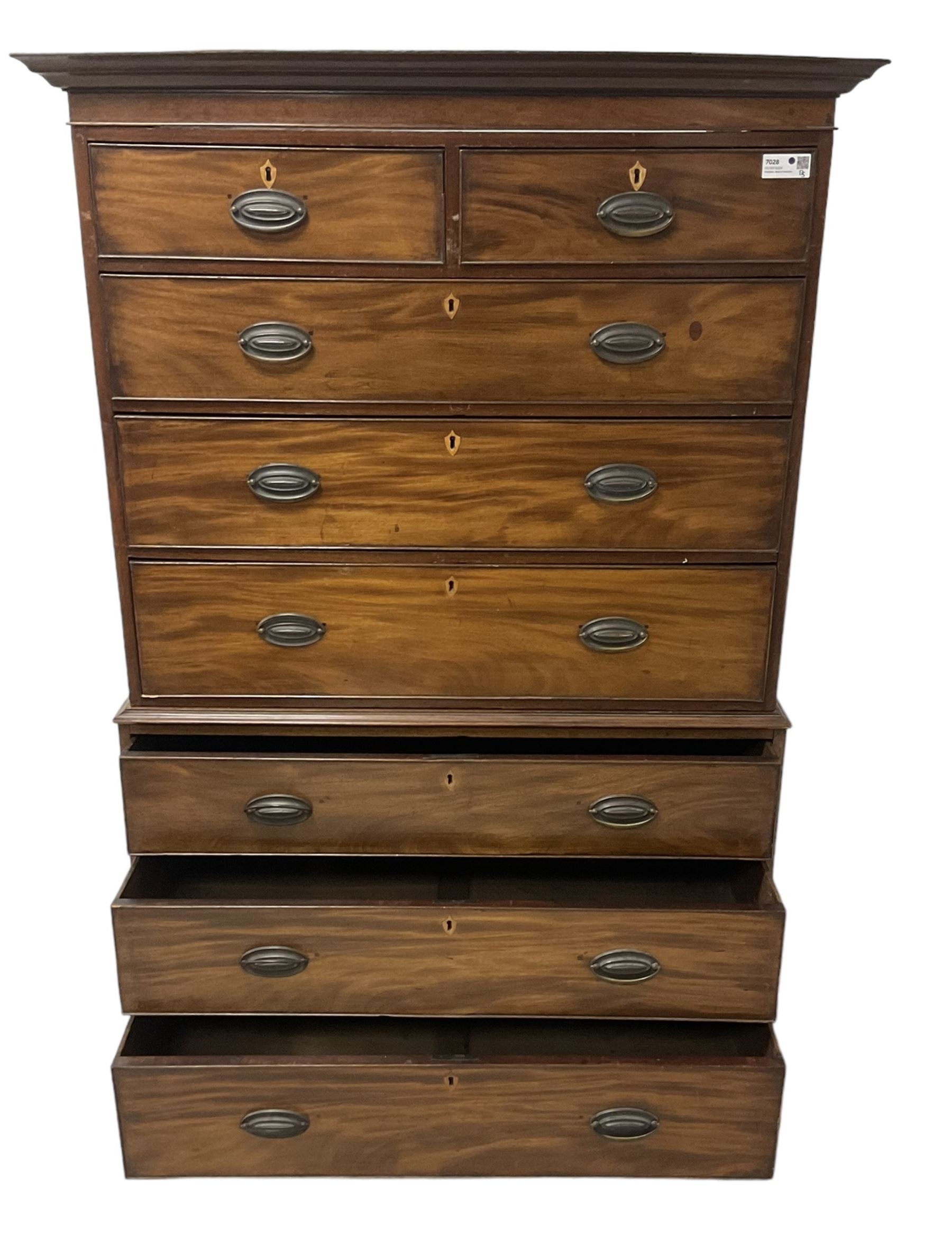 Early 19th century mahogany chest-on-chest, projecting cornice over banded frieze, fitted with two short over six long graduating cock-beaded drawers with bone and timber escutcheons, on bracket feet