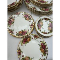 Royal Albert Old Country Roses pattern dinner service for six place settings, comprising dinner plates, side plates, dessert plates, soup bowls, bowls, small plates and salt and pepper shakers, all with printed marks beneath 