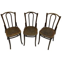 Set of three late 19th to early 20th century century bentwood dining chairs, the seats with pressed anthemion decoration, circa. 1900s