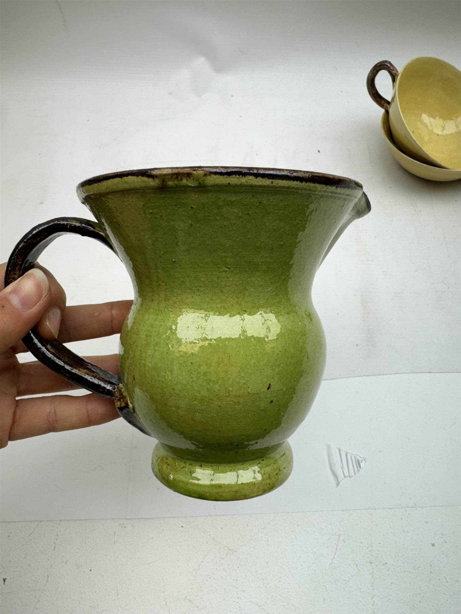 French green and yellow glazed tea and dinner wares by Etienne Noel, including milk jugs, teacups, side plates, bowls etc (43)