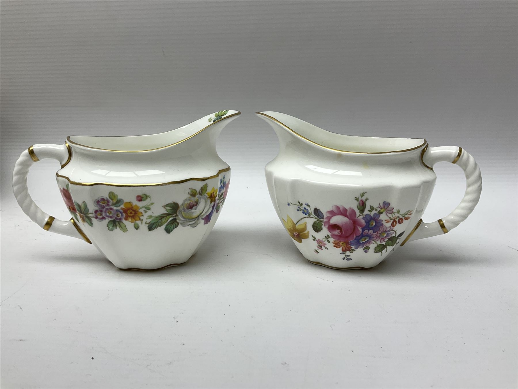 Royal Crown Derby Posies pattern tea service, including two milk jugs, two open sucrier, twelve teacups and saucers, twelve dessert plates etc 