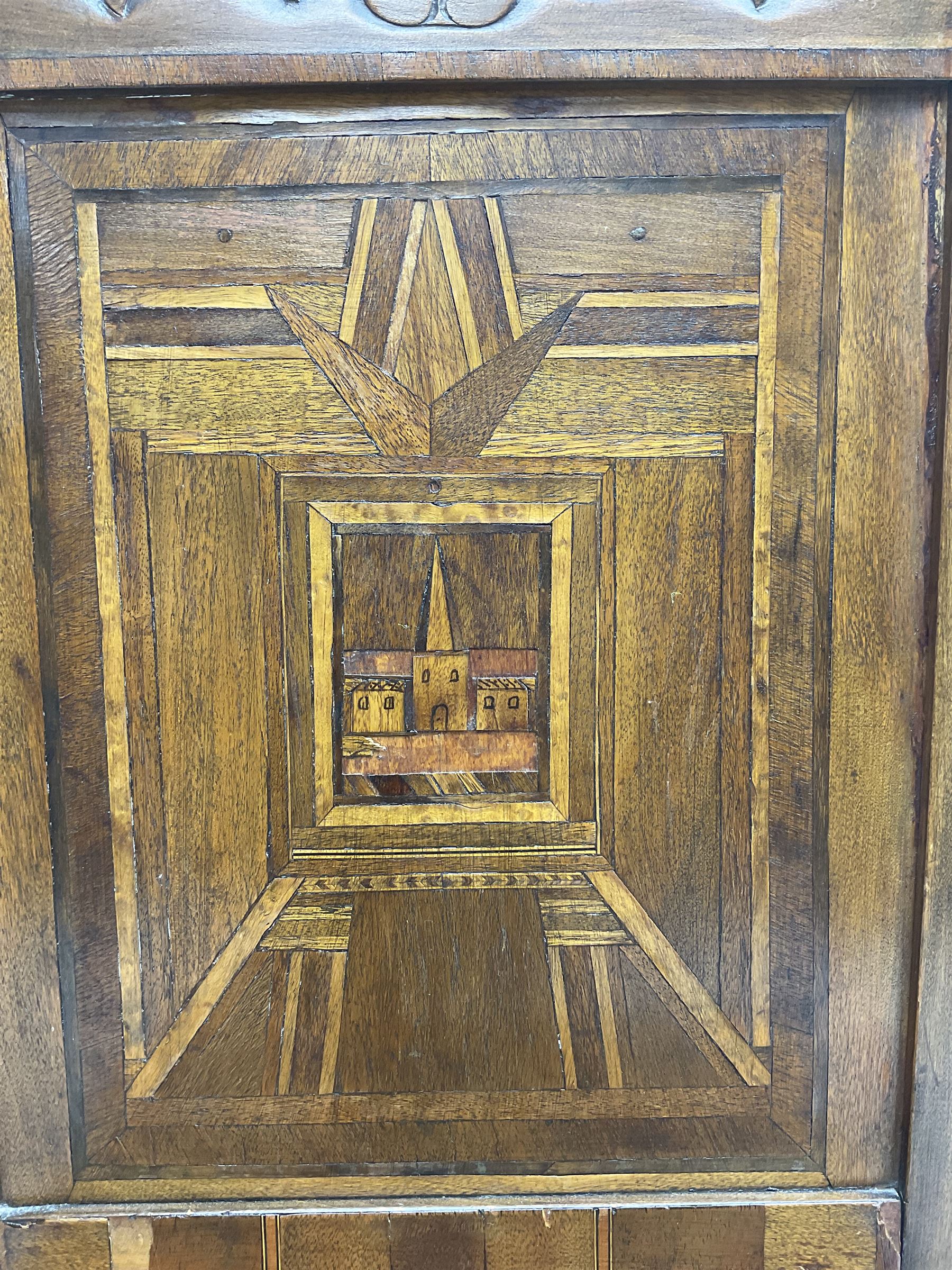 19th century walnut side chair, foliage carved cresting rail over geometric inlaid back with central panel depicting buildings, upholstered seat, on moulded and chamfered square supports