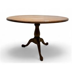 20th century pine tilt-top dining table, circular top with moulded edge over turned pedest...