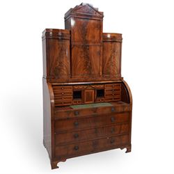 19th century Biedermeier figured mahogany cylinder bureau cabinet, the raised super struct...