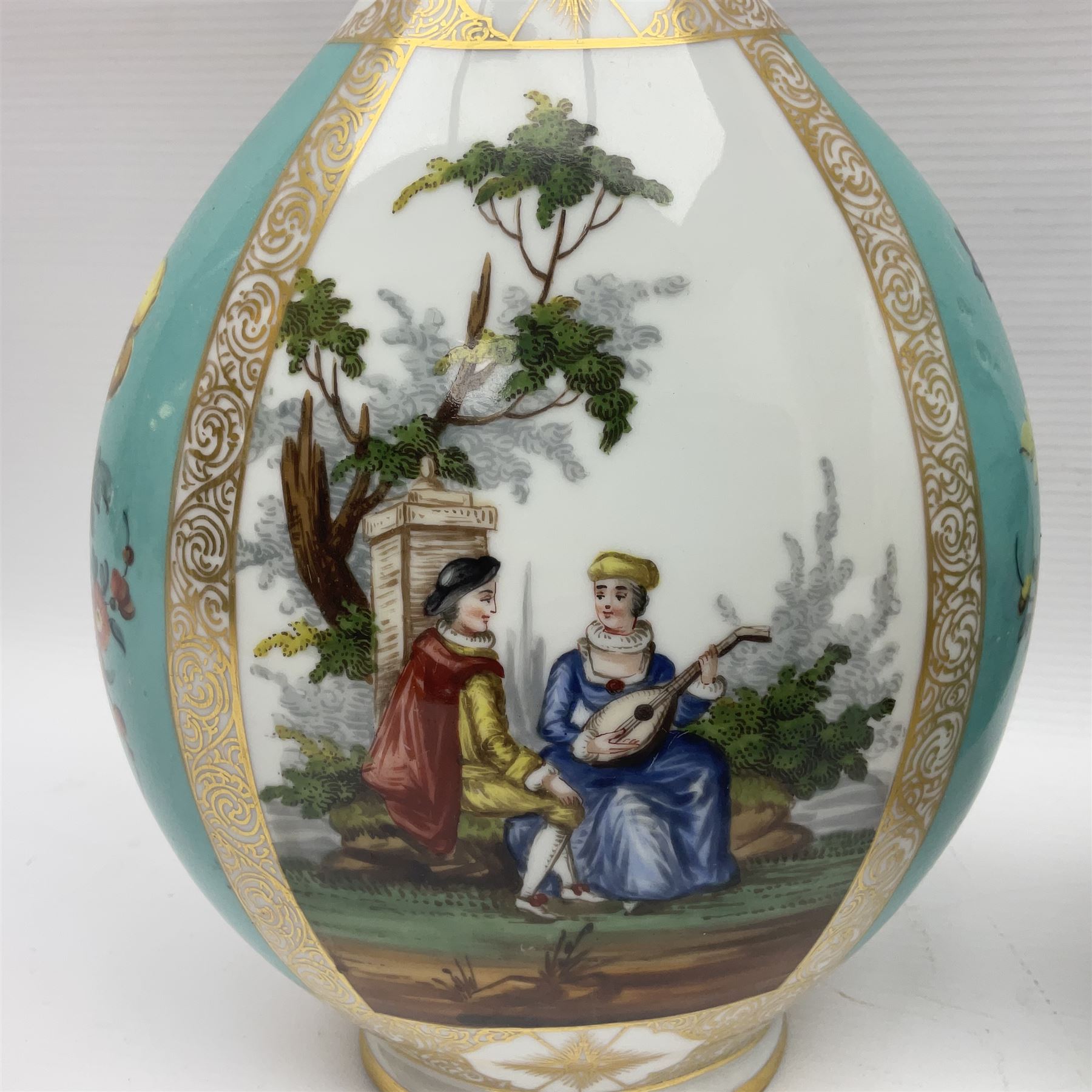 Pair of late 19th century Helena Wolfsohn vases and covers, each of compressed bottle form with tall neck, painted with alternating panels of romantic scenes and floral sprays upon turquoise ground between gilt borders, with Augustus Rex mark to base, H35cm