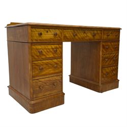 Victorian satin walnut twin pedestal desk, moulded rectangular top with rounded corners and raised back, inset leather writing surface with tooled borders, fitted with nine drawers with turned handles, on moulded plinth base 