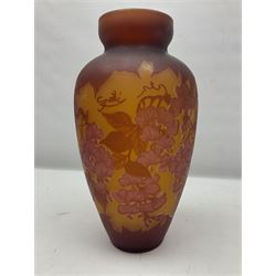 Art Nouveau style glass vase, in the style of Galle, the tapering body decorated with trailing red and pink foliage on a yellow ground, H33cm