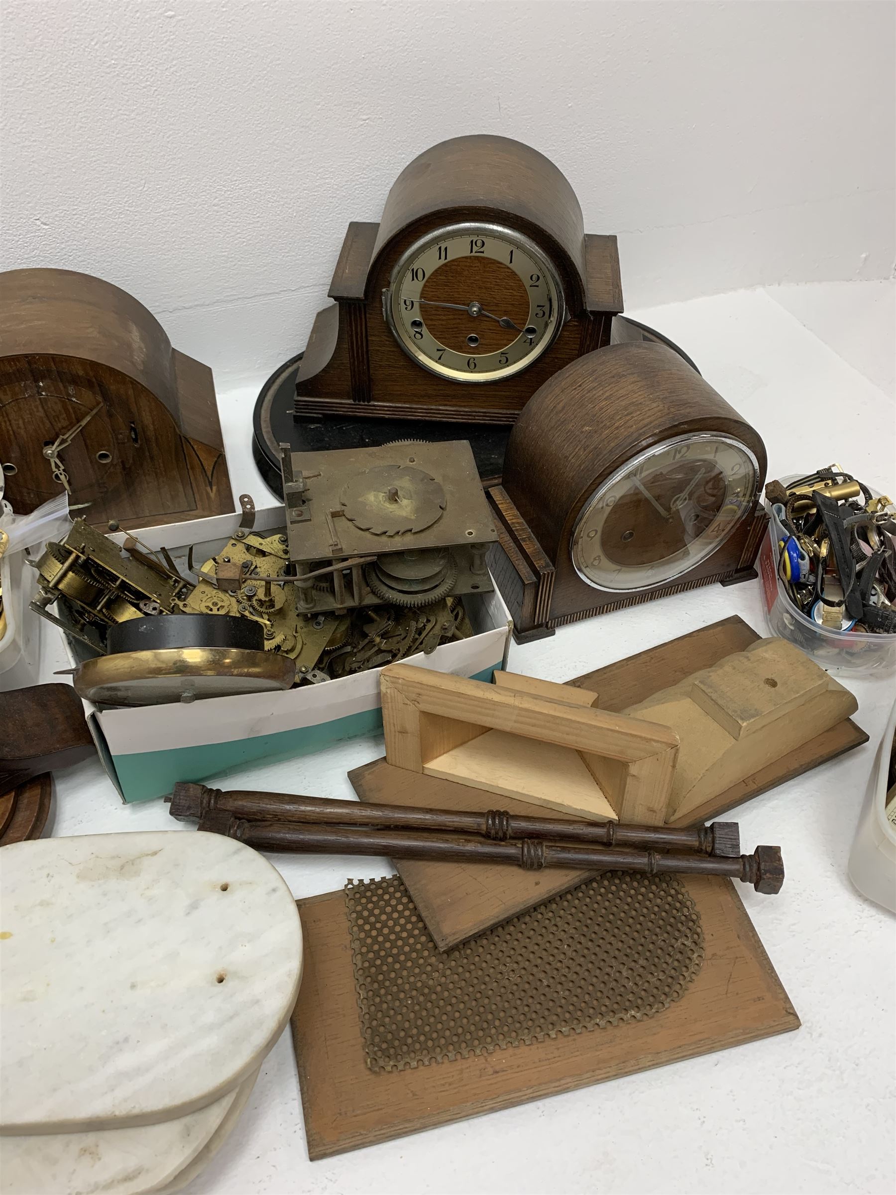 Collection of clock and watch parts - various cases some with movement, ebonised and marble plinths, various clock movements, clock dials, bezels, watches and watch parts etc... in two boxes